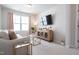 Comfortable living room featuring modern furniture, large window, and natural light at 3144 Star Gazing Ln, Durham, NC 27703