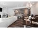 Open-concept layout with a view of the living room, dining area, and modern kitchen at 3144 Star Gazing Ln, Durham, NC 27703