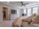 Large main bedroom features a walk-in closet, ceiling fan and bright windows at 3144 Star Gazing Ln, Durham, NC 27703