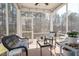 Inviting screened porch with comfortable seating and a peaceful view of the surrounding trees at 3144 Star Gazing Ln, Durham, NC 27703