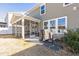 Backyard view of a two-story home, featuring a screened-in porch and fenced yard at 3360 Brevet St, New Hill, NC 27562