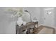 Inviting foyer with a decorative console table, mirror, and hardwood floors, creating a warm entrance at 3360 Brevet St, New Hill, NC 27562