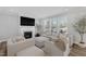 Comfortable living room with a fireplace, large sectional sofa, and plenty of natural light at 3360 Brevet St, New Hill, NC 27562