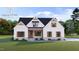 Charming new construction home with board and batten siding, stone accents, and a welcoming front porch at 3400 River Manor Ct, Franklinton, NC 27525