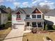 Aerial view of a two-story home with well-manicured landscaping in a residential neighborhood at 3557 S Beaver Ln, Raleigh, NC 27604