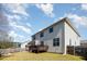 Expansive backyard with a wooden deck, a well-manicured lawn, and perimeter fencing for privacy at 3557 S Beaver Ln, Raleigh, NC 27604