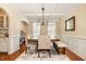 Charming dining room with a large wooden table, bench seating, and coffered ceiling at 3557 S Beaver Ln, Raleigh, NC 27604