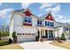 Lovely two-story home featuring a spacious two-car garage and welcoming front porch at 3557 S Beaver Ln, Raleigh, NC 27604