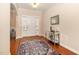 Inviting foyer with hardwood floors, decorative mirror, and a stylish console table at 3557 S Beaver Ln, Raleigh, NC 27604