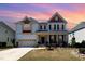 Charming two-story home with a manicured lawn, complemented by a well-maintained front yard and a driveway at 3557 S Beaver Ln, Raleigh, NC 27604