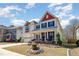 Beautiful two-story home with a well-maintained lawn, landscaped garden, and covered front porch at 3557 S Beaver Ln, Raleigh, NC 27604