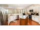Bright kitchen with granite countertops, stainless steel appliances, and hardwood floors, perfect for cooking and entertaining at 3557 S Beaver Ln, Raleigh, NC 27604