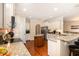 Spacious kitchen with granite countertops, stainless steel appliances, and hardwood floors, offering a modern cooking space at 3557 S Beaver Ln, Raleigh, NC 27604