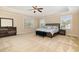 Serene main bedroom features a trey ceiling, large windows, and plush carpeting, creating a relaxing retreat at 3557 S Beaver Ln, Raleigh, NC 27604
