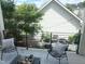 Relaxing back porch with patio furniture overlooking the yard, providing an inviting outdoor space at 4026 Overcup Oak Ln, Cary, NC 27519