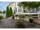 Well-maintained backyard patio with stylish seating, fire pit, and beautiful landscaping, ideal for outdoor enjoyment at 4026 Overcup Oak Ln, Cary, NC 27519