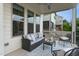 Cozy covered balcony with plush sofa, modern furniture, and serene outdoor ambiance for comfortable lounging at 4026 Overcup Oak Ln, Cary, NC 27519