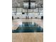 Full-sized basketball court with hardwood floors and professional basketball hoops at 4026 Overcup Oak Ln, Cary, NC 27519