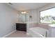 A full bath featuring a garden tub and vanity at 4026 Overcup Oak Ln, Cary, NC 27519