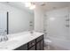Bright bathroom featuring a double sink vanity, tub and shower combo, and tile floors at 4026 Overcup Oak Ln, Cary, NC 27519