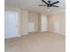 Bonus room with neutral walls and carpet, ceiling fan, and multiple doors at 4026 Overcup Oak Ln, Cary, NC 27519