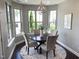 Bright breakfast nook with lots of windows and a view of the backyard at 4026 Overcup Oak Ln, Cary, NC 27519