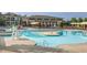 Large community pool features a water slide, fountains, and plenty of seating for residents to enjoy at 4026 Overcup Oak Ln, Cary, NC 27519