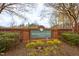 The Residents' Club at Amberly community sign is beautifully landscaped with colorful flowers and greenery at 4026 Overcup Oak Ln, Cary, NC 27519