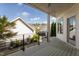 Covered deck area overlooking manicured backyard with a view of neighboring homes at 4026 Overcup Oak Ln, Cary, NC 27519