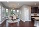 Cozy dining area with hardwood floors, chandelier lighting, and natural light at 4026 Overcup Oak Ln, Cary, NC 27519