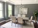 Formal dining room with a modern chandelier and large window at 4026 Overcup Oak Ln, Cary, NC 27519