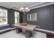 Stylish dining room with modern lighting fixture, neutral decor, and large windows offering lots of sunlight at 4026 Overcup Oak Ln, Cary, NC 27519