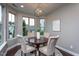Charming dining room featuring a round table, four chairs, and an elegant globe chandelier at 4026 Overcup Oak Ln, Cary, NC 27519
