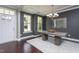 Elegant dining room boasting a stylish chandelier, modern table, ample natural light, and neutral tones at 4026 Overcup Oak Ln, Cary, NC 27519
