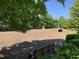 Community dog park with wood chip ground cover, benches, and a tunnel for pet agility at 4026 Overcup Oak Ln, Cary, NC 27519