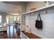 Entryway with a bench, hooks, and access to an open floor plan with a dining area at 4026 Overcup Oak Ln, Cary, NC 27519