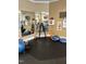 A fitness room is shown with free weights, kettlebells, exercise balls, and other accessories for diverse workouts at 4026 Overcup Oak Ln, Cary, NC 27519