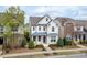 Attractive three-story home boasts a classic exterior with well-maintained landscaping and a welcoming front porch at 4026 Overcup Oak Ln, Cary, NC 27519