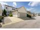 Exterior view of a townhome with a front-facing two-car garage and driveway at 4026 Overcup Oak Ln, Cary, NC 27519