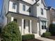 Charming home with brick exterior, covered porch, and manicured landscaping creating an inviting curb appeal at 4026 Overcup Oak Ln, Cary, NC 27519