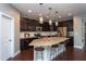Modern kitchen featuring granite countertops, stainless steel appliances and pendant lighting at 4026 Overcup Oak Ln, Cary, NC 27519