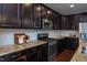 Modern kitchen featuring stainless steel appliances, granite countertops and ample cabinetry at 4026 Overcup Oak Ln, Cary, NC 27519