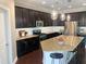Kitchen with dark cabinetry, granite countertops and stainless-steel appliances at 4026 Overcup Oak Ln, Cary, NC 27519