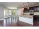 Open kitchen featuring granite countertops, stainless steel appliances, and pendant lighting at 4026 Overcup Oak Ln, Cary, NC 27519