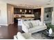Open-concept living room with a view into a kitchen with an island and stainless steel appliances at 4026 Overcup Oak Ln, Cary, NC 27519