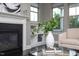 Living room detail with fireplace, built-in shelves, and stylish décor for a comfortable home at 4026 Overcup Oak Ln, Cary, NC 27519