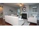 Bright living room with fireplace, built-in shelving, and comfortable seating for a relaxing atmosphere at 4026 Overcup Oak Ln, Cary, NC 27519
