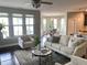 Bright living room featuring large windows, hardwood floors, and modern furnishings at 4026 Overcup Oak Ln, Cary, NC 27519