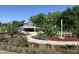 Park offers lush greenery, playground, and pavilion for recreational use with bike rack in a well-maintained community space at 4026 Overcup Oak Ln, Cary, NC 27519