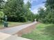 Paved path lined with trees and green lawn area at 4026 Overcup Oak Ln, Cary, NC 27519
